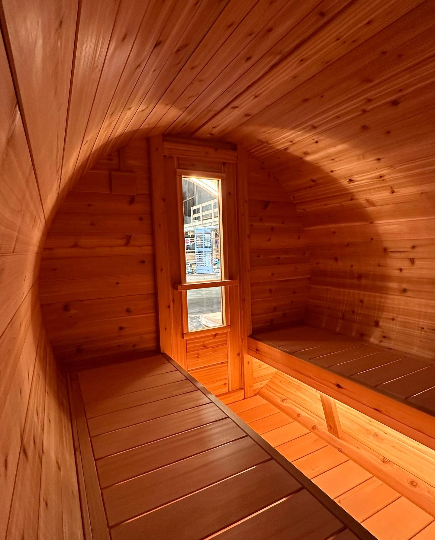 Rich cedar grain and carefully fitted benches inside a sauna